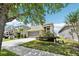 Beautiful two-story home with a well-manicured lawn and inviting two-car garage on a sunny day at 2850 Pewter Mist Ct, Oviedo, FL 32765