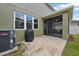 Exterior view of the home featuring a screened-in porch and backyard patio area at 2850 Pewter Mist Ct, Oviedo, FL 32765