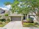 Beautiful two-story home with a well-maintained lawn, a two-car garage and a welcoming front entry at 2850 Pewter Mist Ct, Oviedo, FL 32765