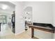 An open kitchen with a black refrigerator and a dining area with granite countertops at 2850 Pewter Mist Ct, Oviedo, FL 32765