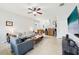 Spacious living room with open floor plan and staircase in view at 2850 Pewter Mist Ct, Oviedo, FL 32765