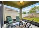 Screened-in porch with outdoor seating and views of the landscaped backyard at 2850 Pewter Mist Ct, Oviedo, FL 32765