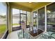 Screened-in porch featuring patio furniture and a view of the backyard and neighborhood at 2850 Pewter Mist Ct, Oviedo, FL 32765