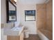Bathroom with tiled shower, modern sink vanity, and neutral color scheme at 332 N Lakeland Ave, Orlando, FL 32805