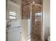 Modern bathroom with tiled walk-in shower and stylish vanity sink at 332 N Lakeland Ave, Orlando, FL 32805