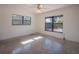 Bright bedroom with terrazzo floors and multiple windows offering natural light at 332 N Lakeland Ave, Orlando, FL 32805