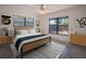 Cozy bedroom with a large windows, complemented by stylish furnishings and serene decor at 332 N Lakeland Ave, Orlando, FL 32805
