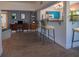 Comfortable living space featuring an open layout with bar seating and a view into the adjacent kitchen at 332 N Lakeland Ave, Orlando, FL 32805