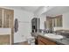 Bathroom with walk-in shower and vanity with dark countertop at 3813 Black Spruce Ln, Winter Springs, FL 32708