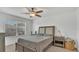 Bright bedroom with ceiling fan, window view and neutral decor at 3813 Black Spruce Ln, Winter Springs, FL 32708