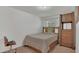 Bedroom with bed, side table and a wardrobe at 3813 Black Spruce Ln, Winter Springs, FL 32708