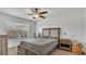 Bright bedroom with ceiling fan, window view and neutral decor at 3813 Black Spruce Ln, Winter Springs, FL 32708