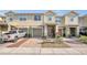 Inviting townhome featuring a private garage and charming front landscaping, showcasing a comfortable and appealing exterior at 3813 Black Spruce Ln, Winter Springs, FL 32708