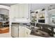 Well-appointed kitchen featuring granite countertops, stainless steel appliances, and ample cabinet space at 404 Sotheby Way, Debary, FL 32713