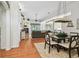 Open-concept living space featuring hardwood floors, a ceiling fan, and seamless flow to other areas at 404 Sotheby Way, Debary, FL 32713