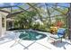 Enclosed pool area showcasing a tranquil spa, lush landscaping, and a lounge chair at 404 Sotheby Way, Debary, FL 32713