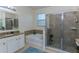 Bathroom with separate shower and bathtub, granite countertops, and ample natural light at 410 E Victoria Trails Blvd, Deland, FL 32724