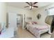 Bedroom with tile flooring, ceiling fan, writing desk and neutral color palette at 410 E Victoria Trails Blvd, Deland, FL 32724
