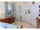 Bright bedroom with a large window, closet and wooden dresser at 410 E Victoria Trails Blvd, Deland, FL 32724