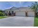 Charming single-story home featuring a two-car garage, stone accents, and well-maintained landscaping at 410 E Victoria Trails Blvd, Deland, FL 32724