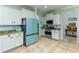 Modern kitchen featuring white cabinets, stainless steel appliances, and granite countertops at 410 E Victoria Trails Blvd, Deland, FL 32724