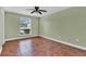 Spacious bedroom featuring tile flooring, natural light, and a ceiling fan at 416 Banyon Tree Cir # 108, Maitland, FL 32751
