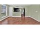 Open living area with ceramic floors, neutral walls, and view into the kitchen at 416 Banyon Tree Cir # 108, Maitland, FL 32751