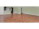 Open living area with ceramic floors, neutral walls, and view into the kitchen at 416 Banyon Tree Cir # 108, Maitland, FL 32751