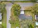 Overhead shot of property showing lush greenery, pool, and street access in a neighborhood setting at 4201 Mizell St, Orlando, FL 32812