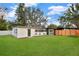Exterior of home with lush backyard and small landscaping at 4201 Mizell St, Orlando, FL 32812