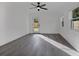 Bright bedroom features natural light, a ceiling fan, and hardwood floors at 4201 Mizell St, Orlando, FL 32812
