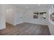 Charming bedroom with wood-look floors, double doors, natural light, and modern trim at 4201 Mizell St, Orlando, FL 32812
