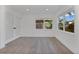 Bright bedroom featuring hardwood floors, double doors, and natural light at 4201 Mizell St, Orlando, FL 32812