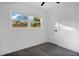 Comfortable bedroom features a window, closet, hardwood floors, and natural light at 4201 Mizell St, Orlando, FL 32812