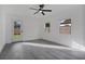 Well-lit bedroom featuring a ceiling fan, natural light, and an exterior door at 4201 Mizell St, Orlando, FL 32812