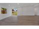 Bright living room with sliding glass door, hardwood floors, and backyard views at 4201 Mizell St, Orlando, FL 32812