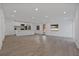 Spacious living area with recessed lighting, wood-look floors, and an open layout to the contemporary kitchen at 4201 Mizell St, Orlando, FL 32812