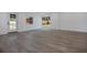 Spacious living room features sliding glass doors to yard and wood-look flooring at 4201 Mizell St, Orlando, FL 32812