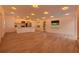 Open-concept living area features recessed lighting, wood floors, and a modern kitchen at 4201 Mizell St, Orlando, FL 32812