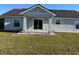 View of the back porch area of the home with a sliding glass door at 468 Marion Oaks Blvd, Ocala, FL 34473