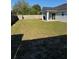 Large backyard of the home with a wood fence surrounding the property at 468 Marion Oaks Blvd, Ocala, FL 34473