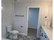 Modern bathroom with a glass-enclosed shower, stylish vanity, and decorative tile flooring at 468 Marion Oaks Blvd, Ocala, FL 34473