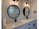 Bathroom boasts double sinks, modern fixtures, and stylish lighting at 468 Marion Oaks Blvd, Ocala, FL 34473
