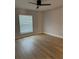 This bright bedroom features a ceiling fan, light wood flooring and neutral walls at 468 Marion Oaks Blvd, Ocala, FL 34473