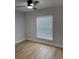 Bedroom includes a ceiling fan, window, and light wood flooring at 468 Marion Oaks Blvd, Ocala, FL 34473