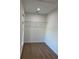 Empty walk-in closet features vinyl floors and a wire shelf at 468 Marion Oaks Blvd, Ocala, FL 34473