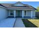 Inviting home entrance with a stylish front door and decorative stone landscaping at 468 Marion Oaks Blvd, Ocala, FL 34473