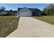 Charming single-story home with a well-manicured lawn and a two-car garage at 468 Marion Oaks Blvd, Ocala, FL 34473