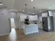 Modern kitchen features white cabinets, stainless steel appliances, and a center island at 468 Marion Oaks Blvd, Ocala, FL 34473