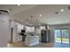 Open concept kitchen with stainless steel appliances, a kitchen island, and hardwood floors at 468 Marion Oaks Blvd, Ocala, FL 34473